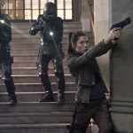 Federal Police come up behind Melina (Jessica Biel, foreground) as she covers Quaid's escape out of Matthias' Lair in Columbia Pictures' action thriller TOTAL RECALL.